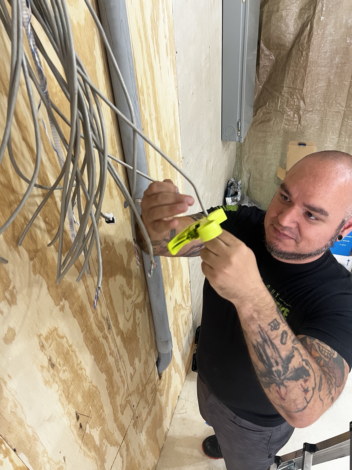 Luis Rodriguez preparing network cabling at a business installation